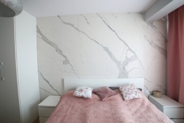 A bedroom wall - Laminam Statuario Venato quartz sinters.