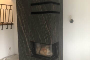 A fireplace structure - Naturali Noir Desir quartz sinter